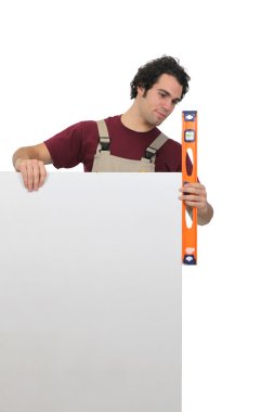 Man using spirit level clipart