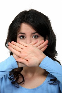 Woman covering her mouth with her hands clipart