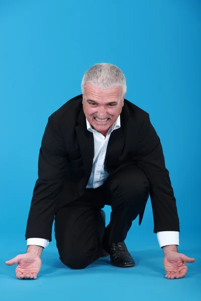 Businessman attempting to lift — Stock Photo, Image