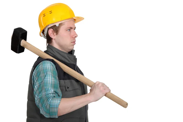 A construction worker with a sledgehammer. — Stockfoto