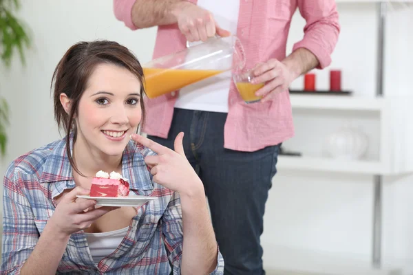 Woman eating a piece of cake — Stock Photo, Image