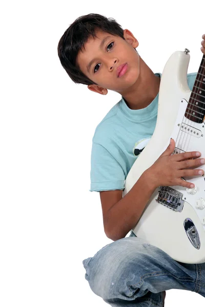 Junge spielt Instrument — Stockfoto