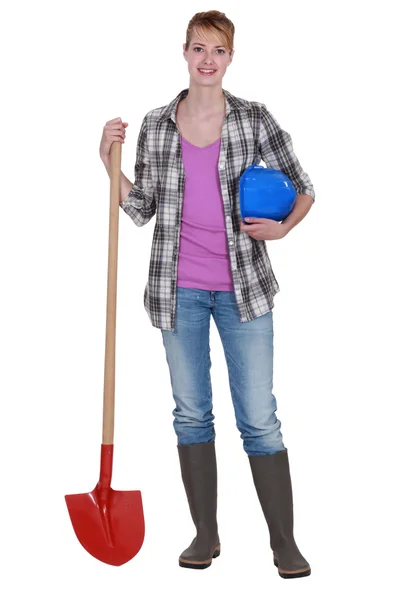 Woman with a shovel — Stock Photo, Image