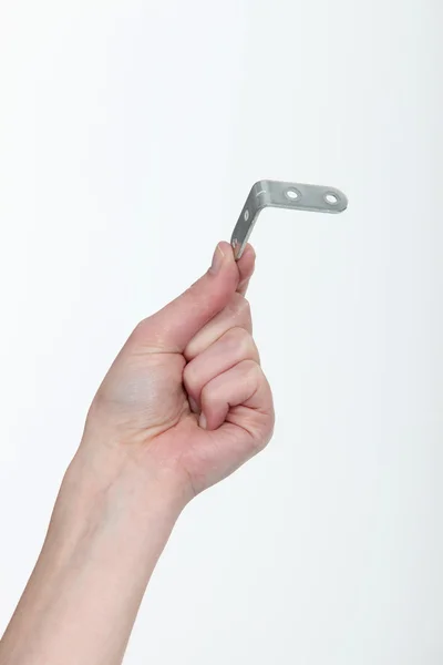 En hand som visar en vinkelparentes — Stockfoto