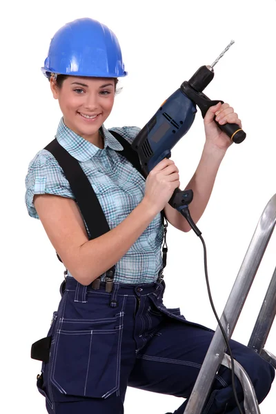 Tradeswoman segurando uma ferramenta de poder — Fotografia de Stock