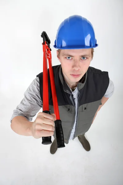 Robotnik budowlany z nożycami do metalu — Zdjęcie stockowe