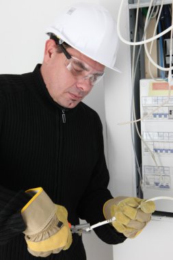 Man fixing fuse box clipart