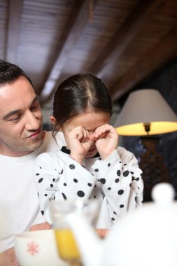 Man comforting his daughter clipart