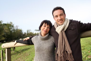 Couple taking a stroll in the countryside clipart