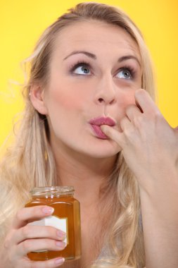 Woman tasting jam clipart