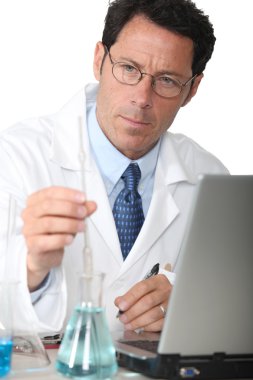 Lab technician analyzing test results clipart