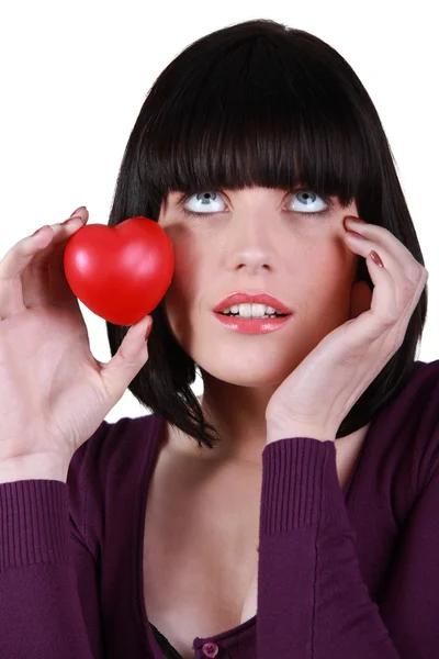 Woman with heart in hand — Stock Photo, Image