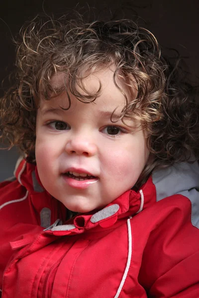 Kid wearing coat outdoors — Stock Photo, Image