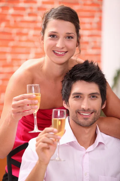 Elegant couple drinking champagne — Stock Photo, Image