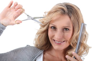 Hairdresser with scissors and a comb clipart
