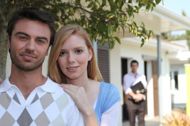 Couple visiting house for sale clipart