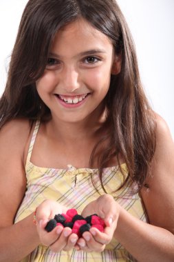 Little girl holding candy clipart