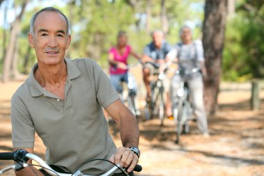 Man riding his bicycle clipart