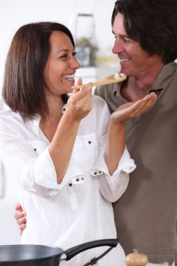 Man and woman in the kitchen clipart