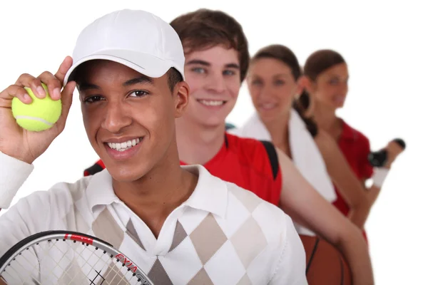 Four young illustrating different sports — Stock Photo, Image