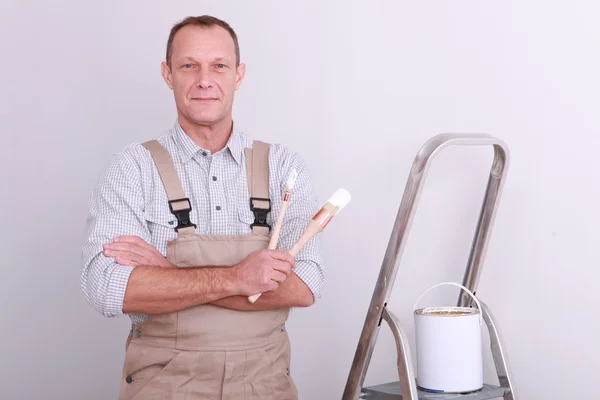Painter with brush in hand — Stock Photo, Image