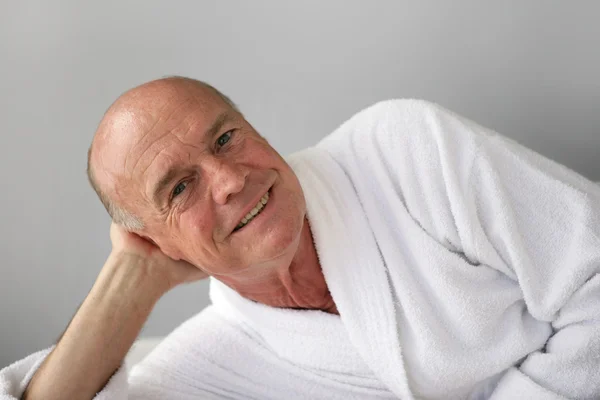 Retired man relaxing in bathrobe — Stock Photo, Image