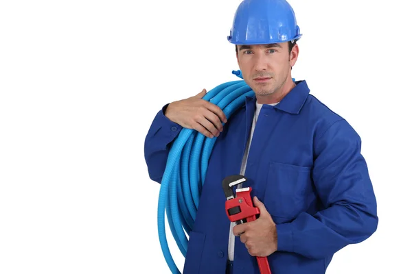Trabalhadores com rolo de tubo azul — Fotografia de Stock