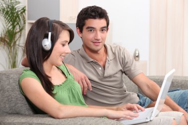 Teens sitting on couch clipart