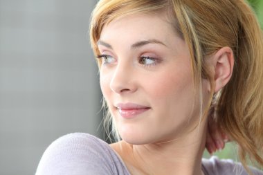 Blond woman looking sideways clipart