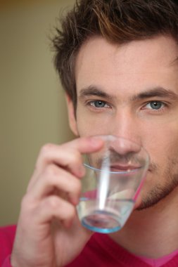 Man drinking from glass clipart