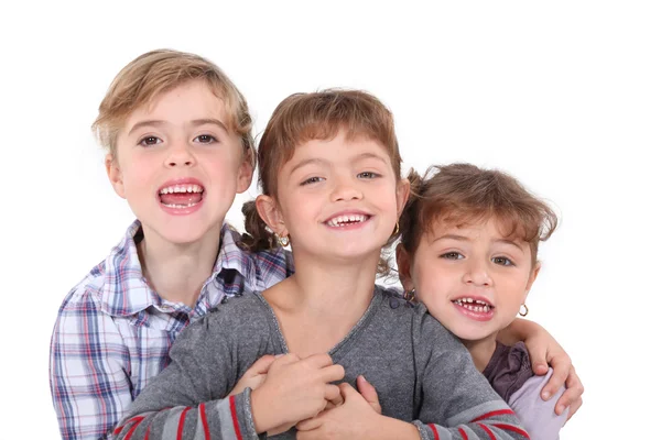 Studio portrait of three young siblings — Stock Photo, Image