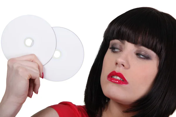 Woman holding cds — Stock Photo, Image