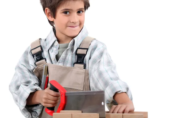Criança fingindo ser um carpinteiro adulto — Fotografia de Stock