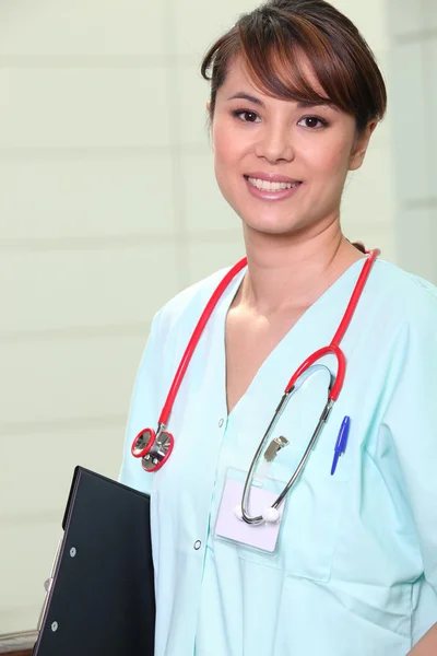 Nurse with clip-board — Stock Photo, Image