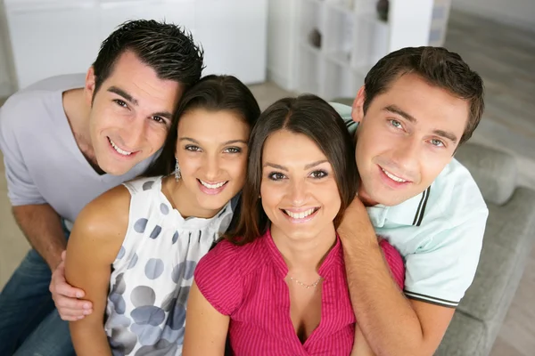 Two couples at home Stock Image