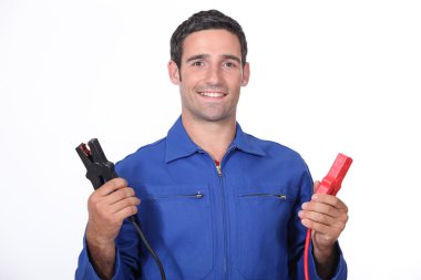 Man car mechanic with alligator clips clipart