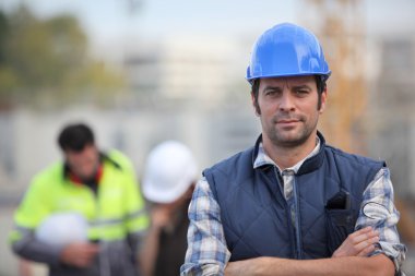 Confident foreman on construction site clipart