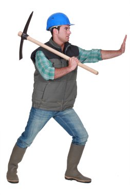 Miner using pick-Axe clipart