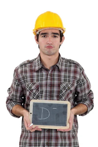 Unhappy tradesman giving a grade of D minus — Stock Photo, Image