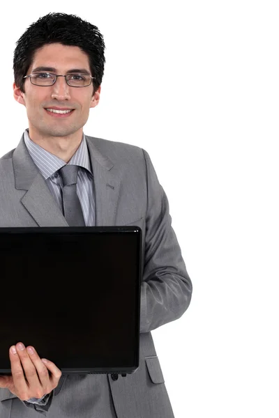 Vrolijke zakenman holding laptopcomputer — Stockfoto