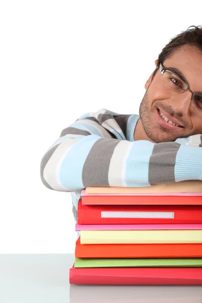 Smiling man with a stack of files — Stock Photo, Image
