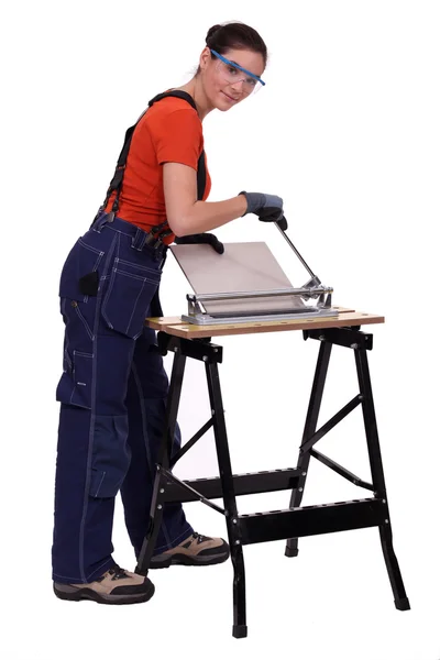 Woman cutting tiles — Stock Photo, Image