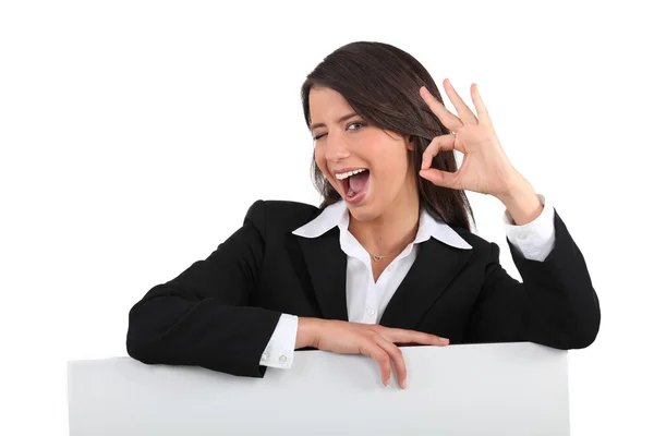 Businesswoman winking — Stock Photo, Image