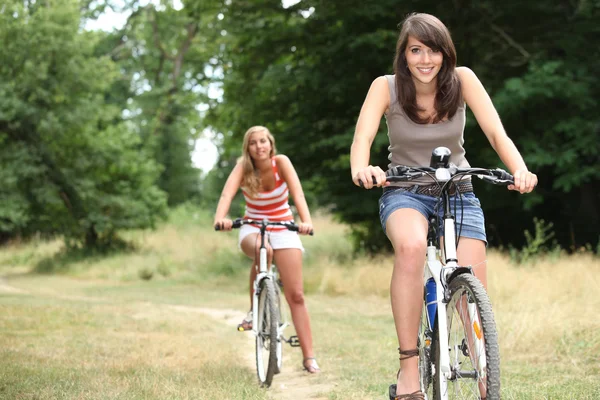 Girls on bikes — Stock Photo, Image