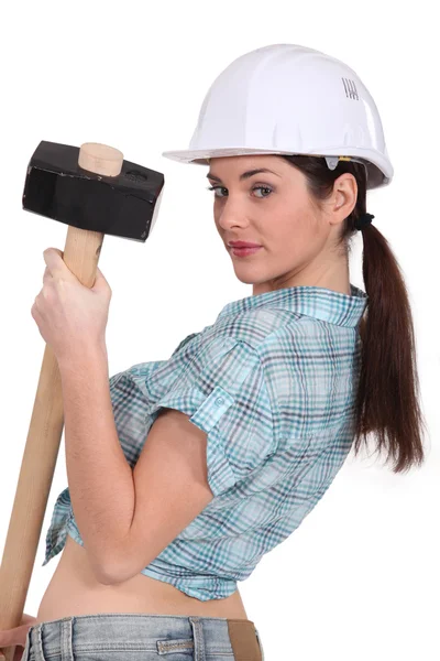 Sexy woman holding a huge hammer — Stock Photo, Image