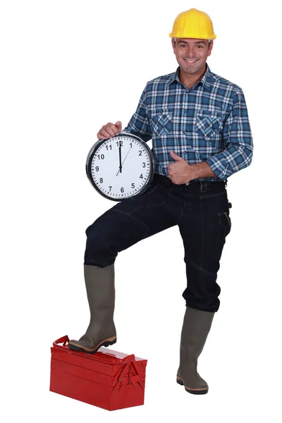 Builder holding large block — Stock Photo, Image