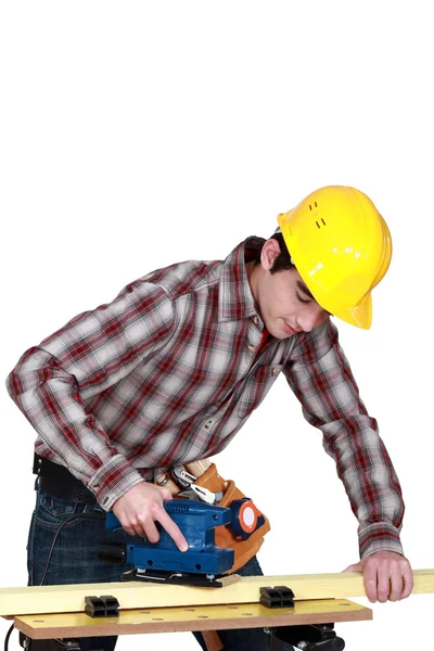 Hantverkare som arbetar på en planka — Stockfoto