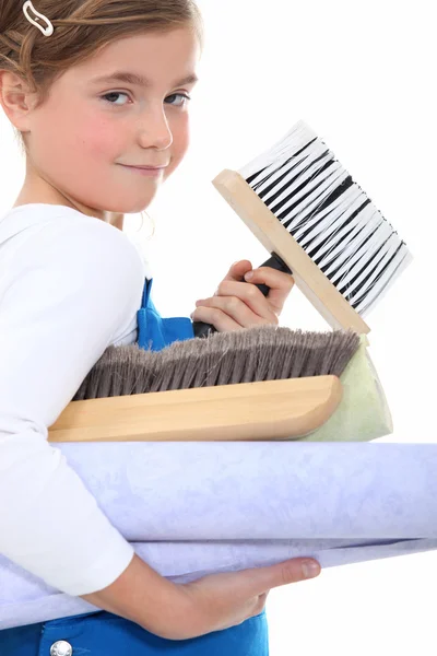 Little girl wants to lay wallpaper — Stock Photo, Image