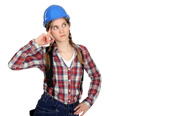 Fundersam kvinnlig builder — Stockfoto