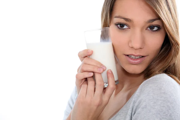Young woman with a glass of milk Stock Image
